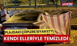 Plajdaki çöplere isyan etti, kendi elleriyle temizledi