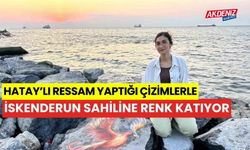 Hatay'lı ressam kayalara yaptığı çizimle sahile renk katıyor