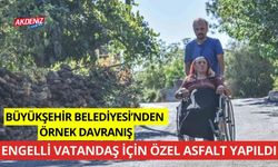 Antalya Büyükşehir Belediyesi'nden örnek davranış engelli vatandaşa özel asfalt yapıldı